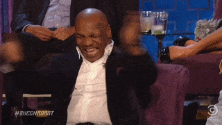 Mike Tyson clapping and laughing