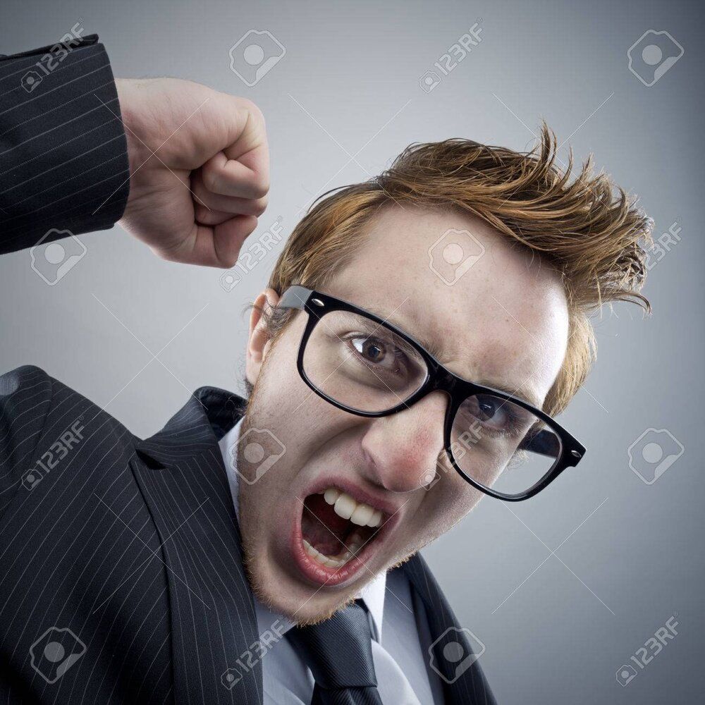 25121800 portrait of mad nerd businessman shouting at camera