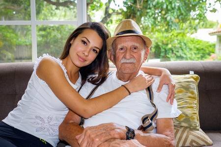 52651446-elderly-eighty-plus-year-old-man-with-granddaughter-in-a-home-setting-.jpg