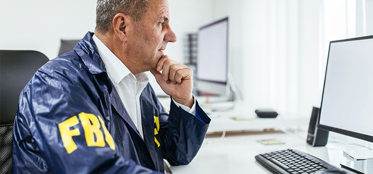 Male fbi agent working on computer