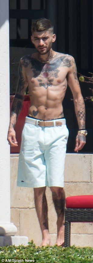 4A4B7E8500000578 5514095 Zayn Malik flaunted his new body art as he went shirtless on Sat a 1 