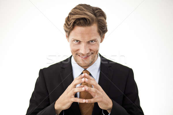 3225536 stock photo contemplating businessman holding fingers together in front