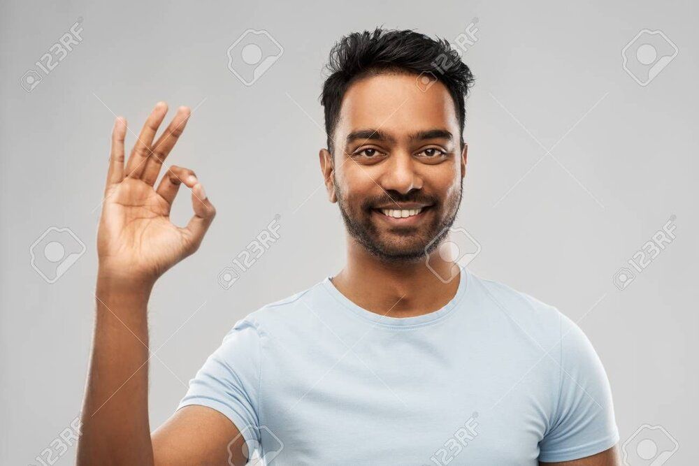 111828052 happy indian man in t shirt showing ok hand sign
