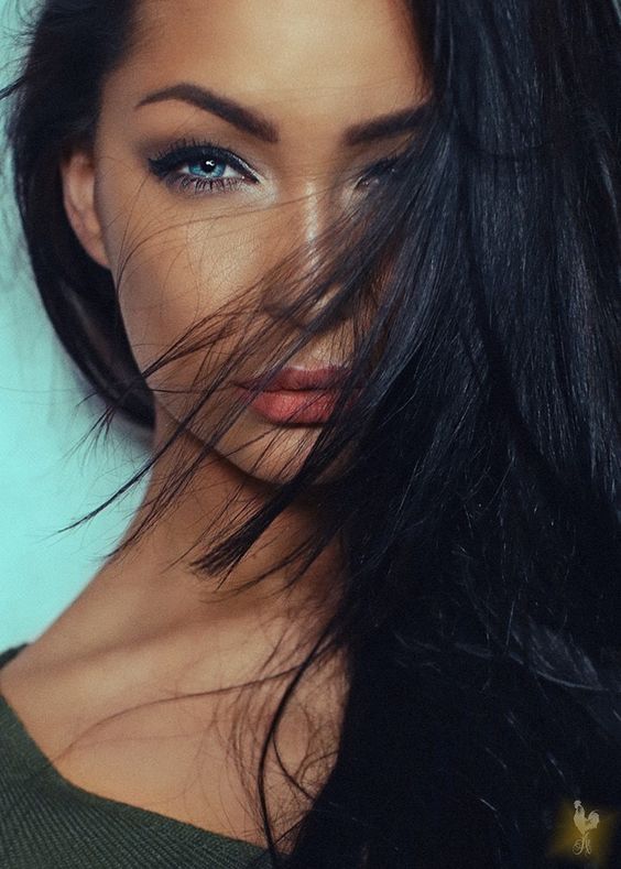 Beautiful girl with black hair and blue eyes