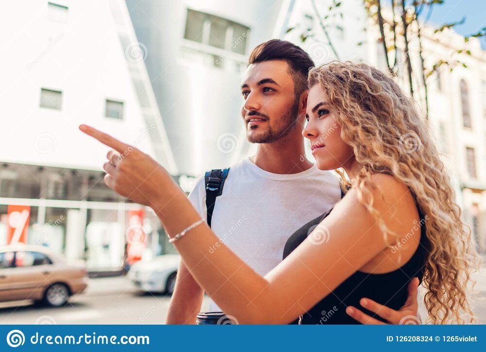 Mixed race couple tourists walking city arab man white woman going shopping mixed race couple 