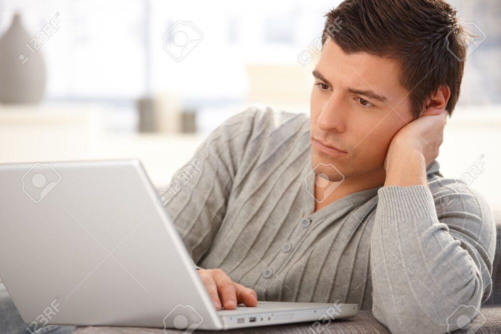 8398148 portrait of goodlooking man focusing on laptop computer screen typing on keyboard look