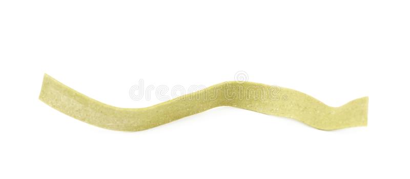 Single piece fettucce pasta isolated single piece green fettucce pasta isolated over white bac