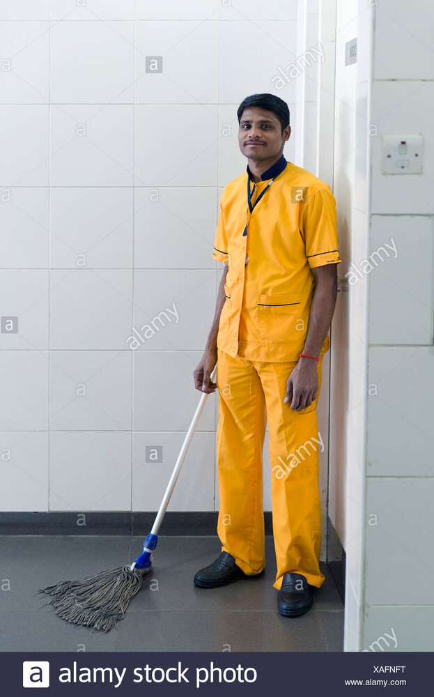 Man cleaning a toilet hyderabad airport andhra pradesh southern india india asia XAFNFT