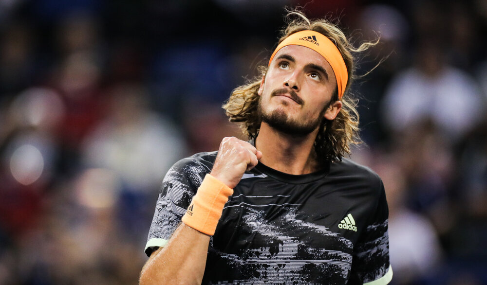 Stefanos Tsitsipas looking skywards from PA