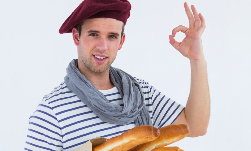 Bigstock French guy with beret holding 85575563 1