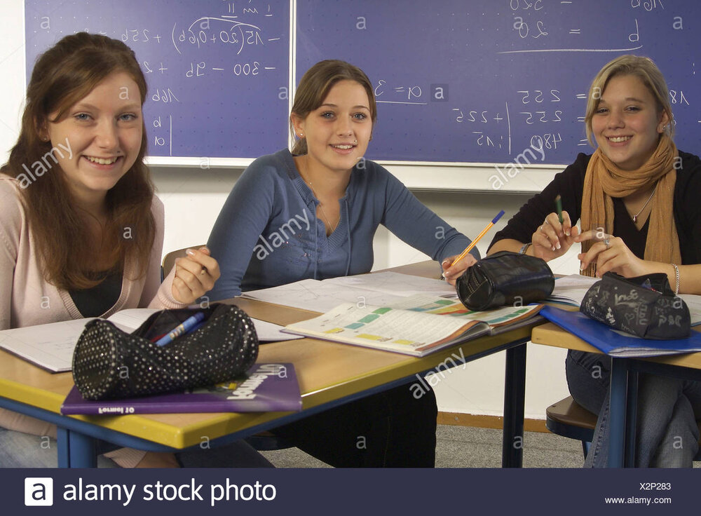 Classrooms schoolgirl laughs series three watching camera portrait people teenagers schoolmate