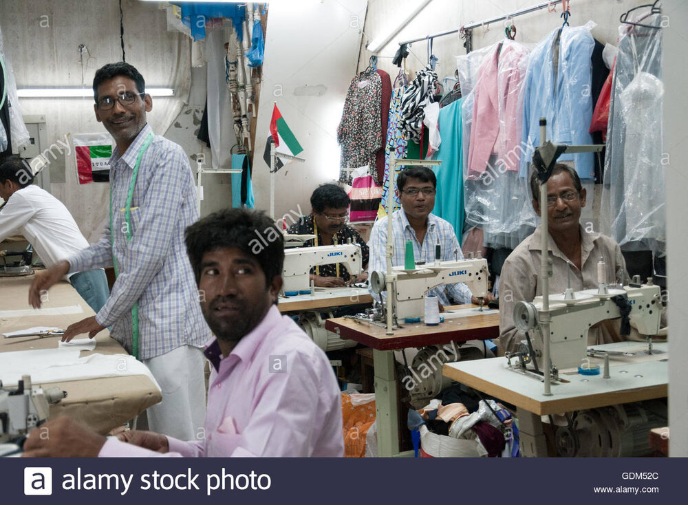 Asian workers in tailor shop in the uae GDM52C