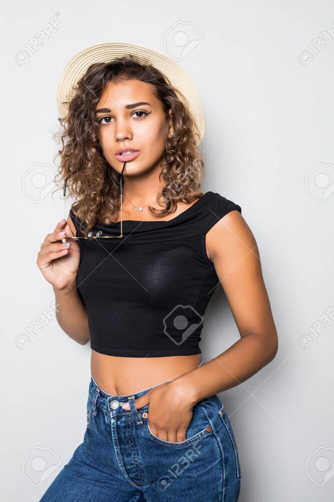 111189864 portrait of a latino american mulatto girl in a casual and straw hat isolated on whi