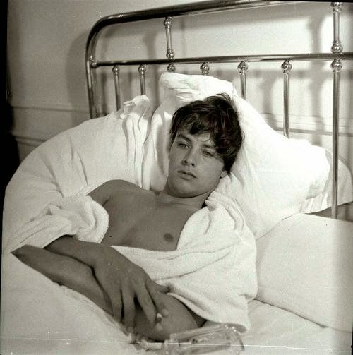 Alain Delon in bed