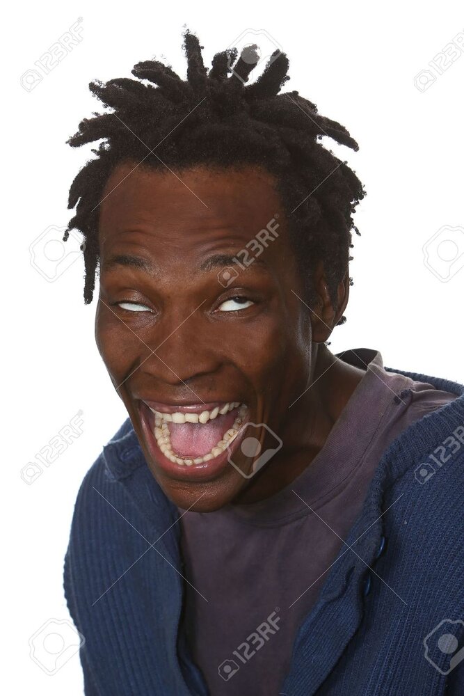 6908024 young black man with dreadlocks hairstyle and crazy look on face