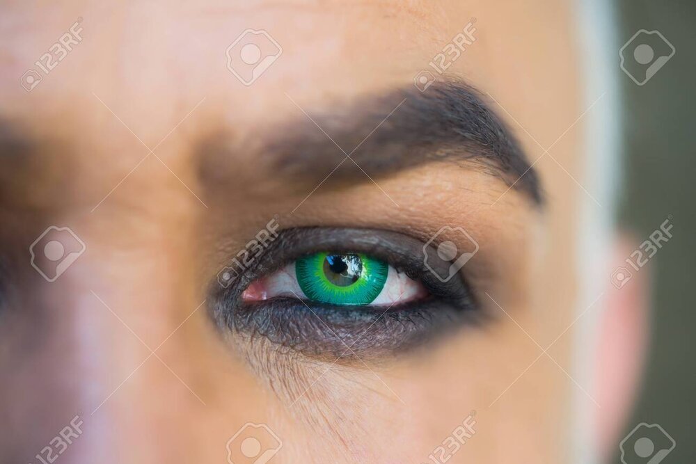 64985730 male green bright eye with make up on and arched eyebrow