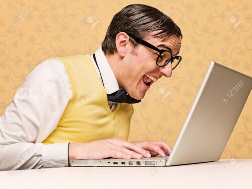 36442487-young-nerd-sitting-at-the-computer.jpg