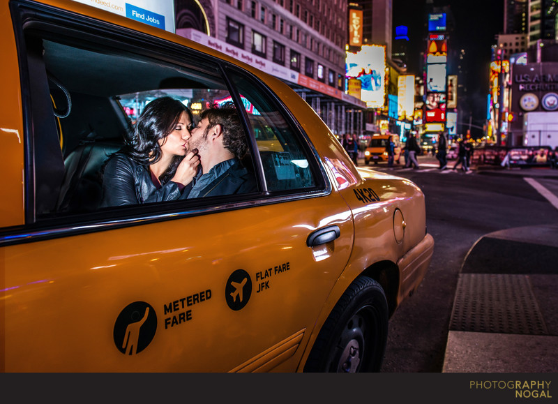 Couple kissing nyc taxi cab times square