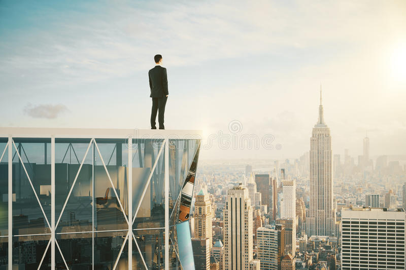 Man top skyscraper looking city businessman 61679854
