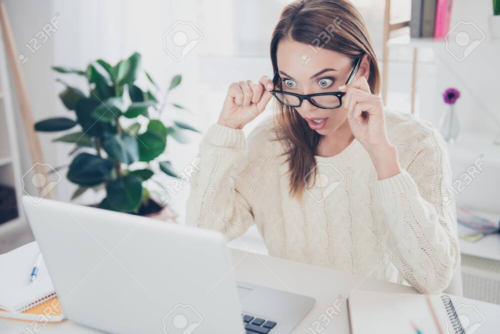 104728946 portrait of stressed unexpected shocked woman looking out glasses on her face at scr