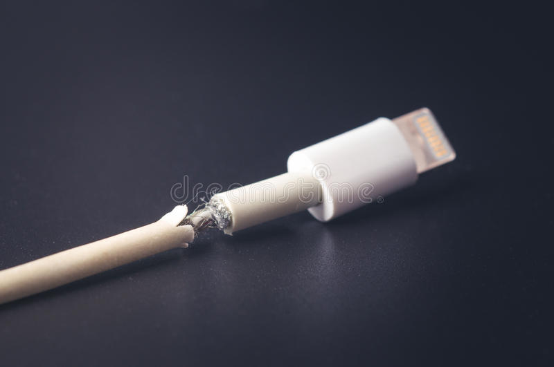 Closeup broken smart phone charger cable black background 82403681