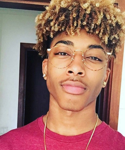 A photograh of a black male interviewed at Manly Curls and who has highlighted medium kinky cu