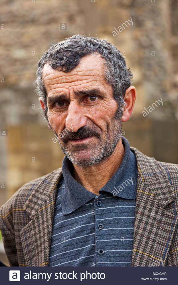 Georgian man with face full of character outside sveti tskhoveli cathedral BXXCHP