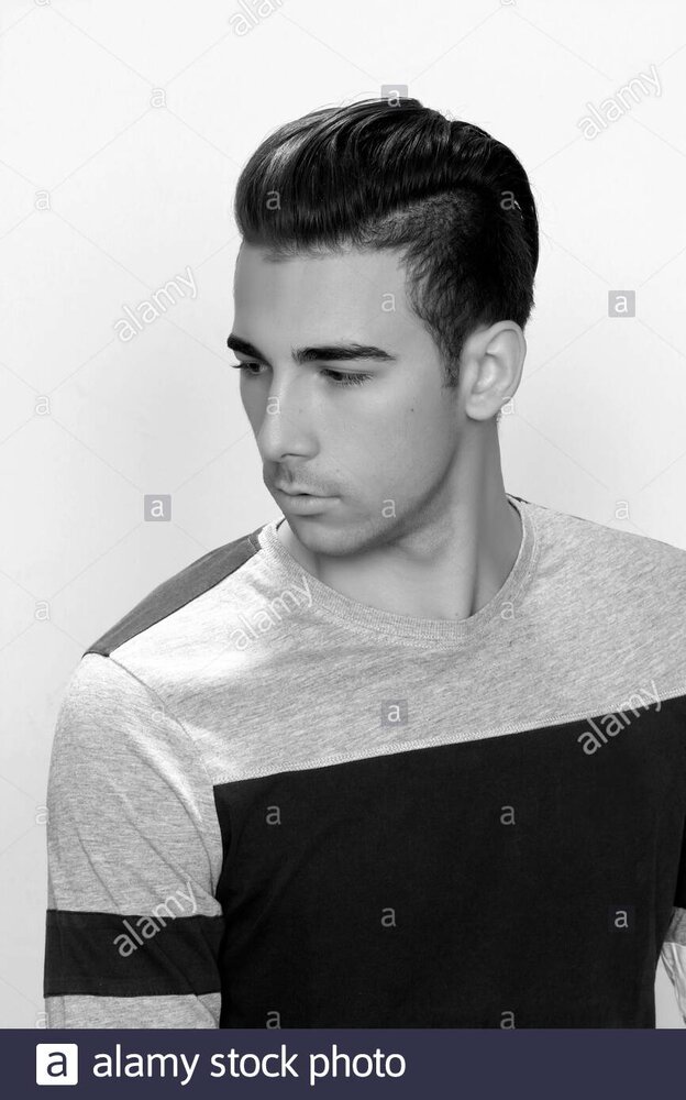 Attractive male model with short hair posing in studio on isolated background style trends fas