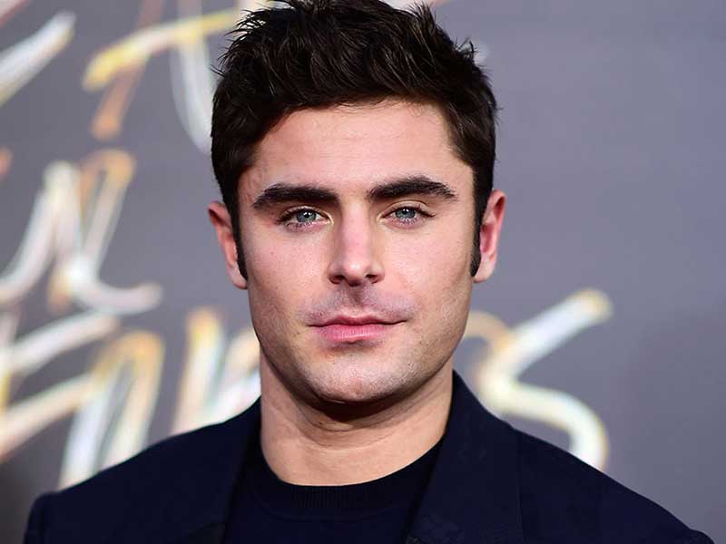 3 1 2 Zac Efron with his black hair and blue eyes