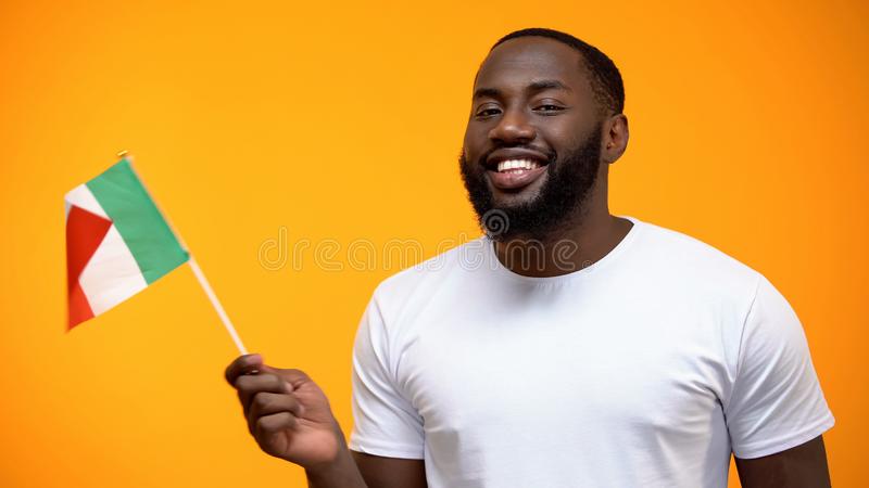 Smiling afro american man holding italian flag international friendship concept stock photo 14