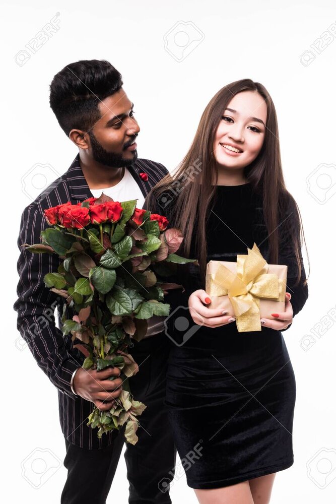 123147518 attractive young asian woman and handsome indian man are standing with gift box and 