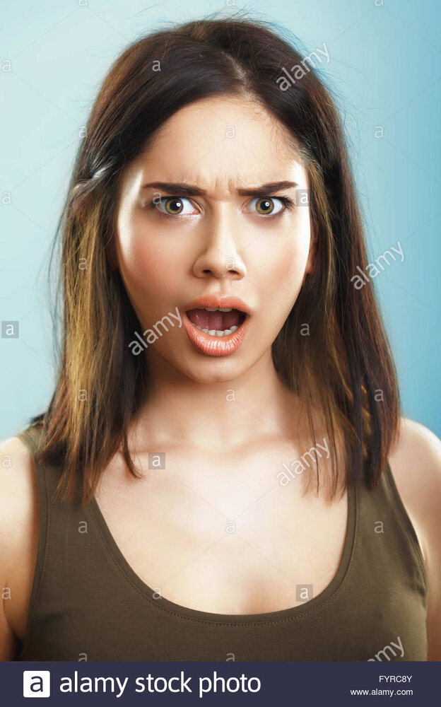 Face of shocked surprised young woman FYRC8Y