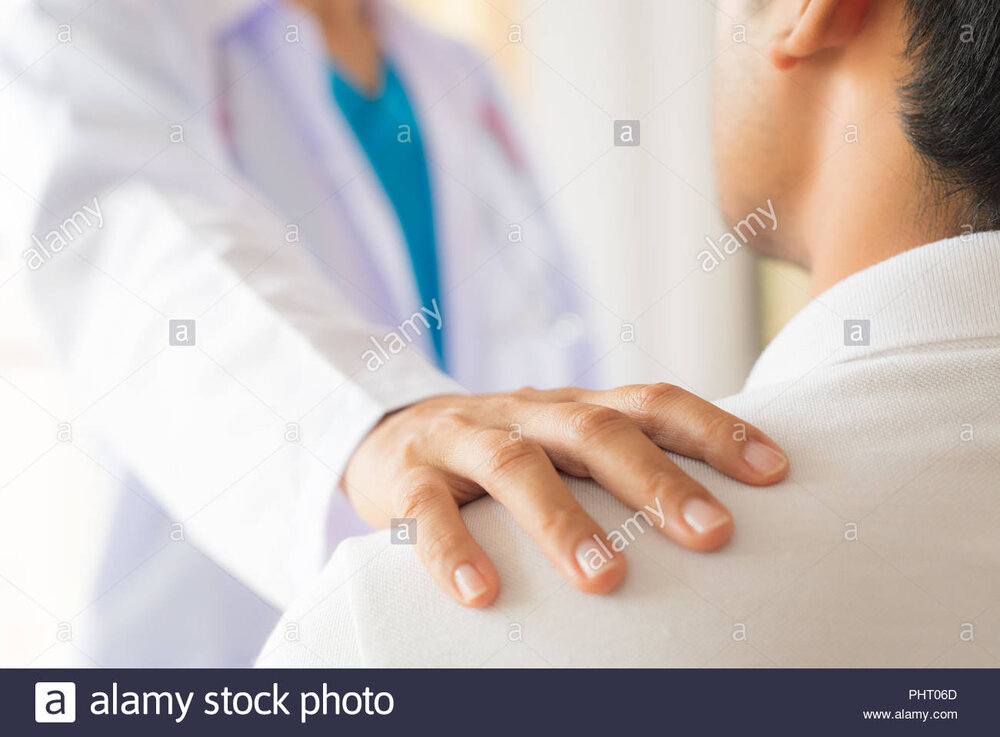 Female doctor put hand on patient shoulder for encouragement and discussion medicine and healt