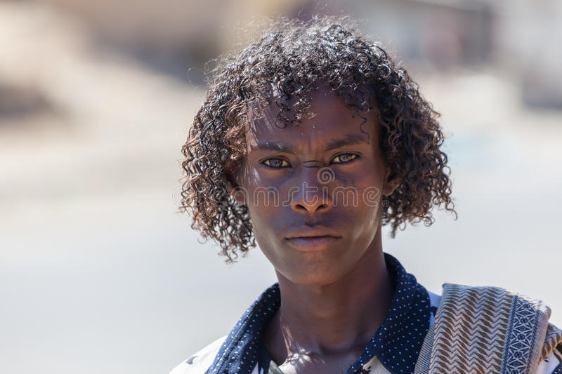Afar men tigray ethiopia tribe man curly hair facial tattoos 83625676