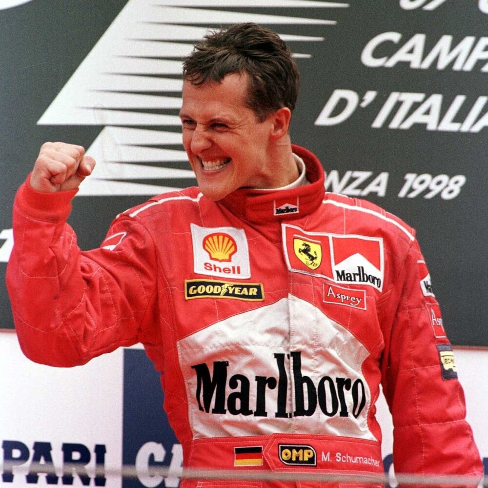 970854 Italian GP13 Sep 1998  Michael Schumacher of Germany  celebrates winning the Italian Fo
