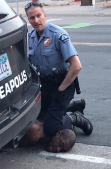 220px George Floyd neck knelt on by police officer