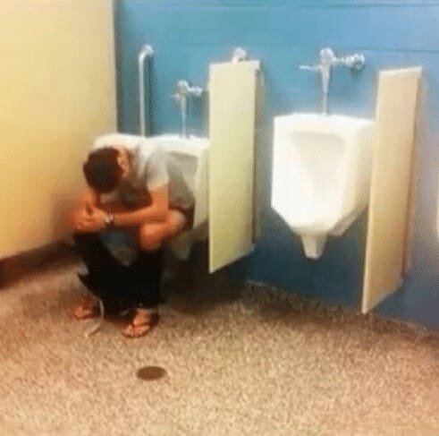 This man is shitting in a urinal lmao 45692419