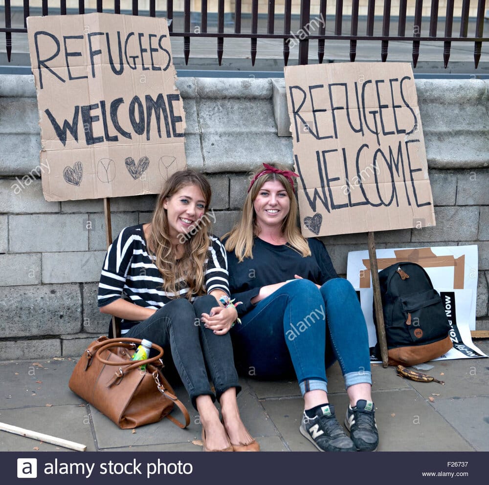 London uk 12th sep 2015 two girls rest during a rally to show solidarity F26737