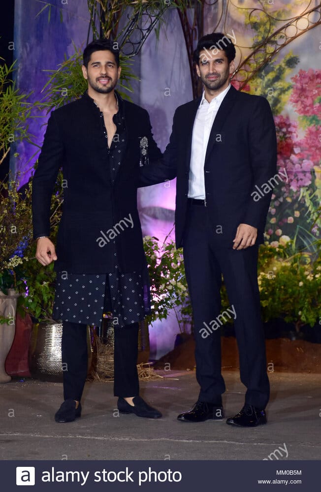 Indian film actor siddharth malhotra and aditya roy kapoor attend the wedding reception of act