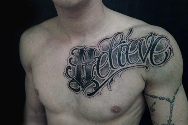 Believe lettering tattoo male chest