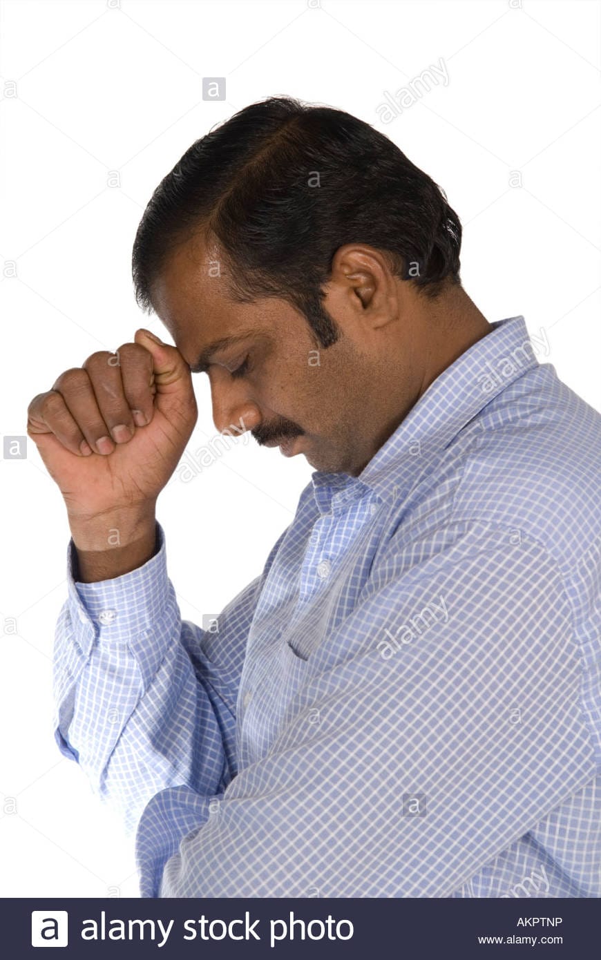 Side view of a sad indian man AKPTNP