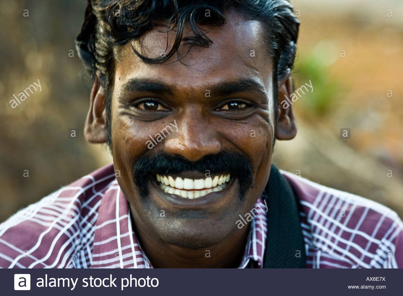 Indian man with a big smile in cochin india AX6E7X