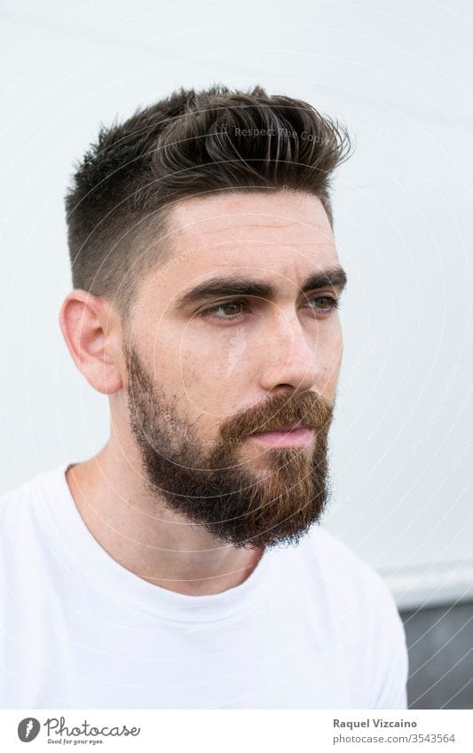 3543564 portrait of a very handsome caucasian man with a beard and white shirt dot photocase s