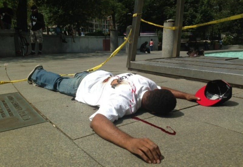Dead black man on street