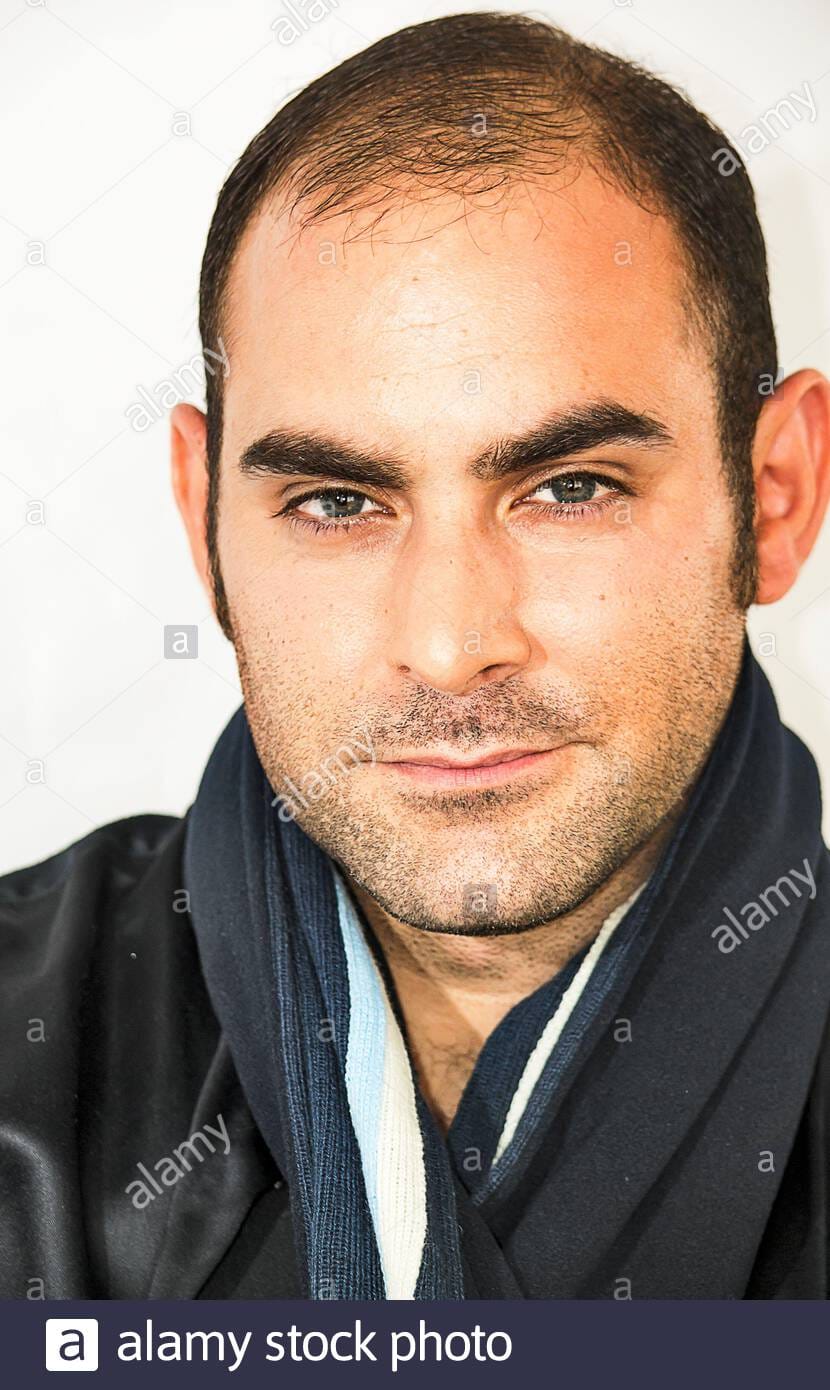 Portrait of a handsome mediterranean man on a white background 2C6X5M6