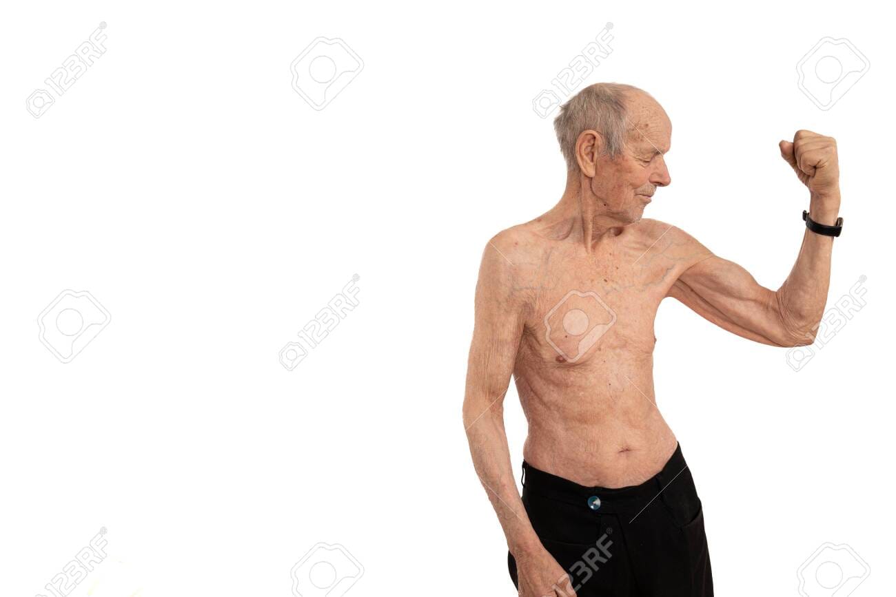 138776284 waist up portrait of an old man with white hair stands showes his biceps and looking