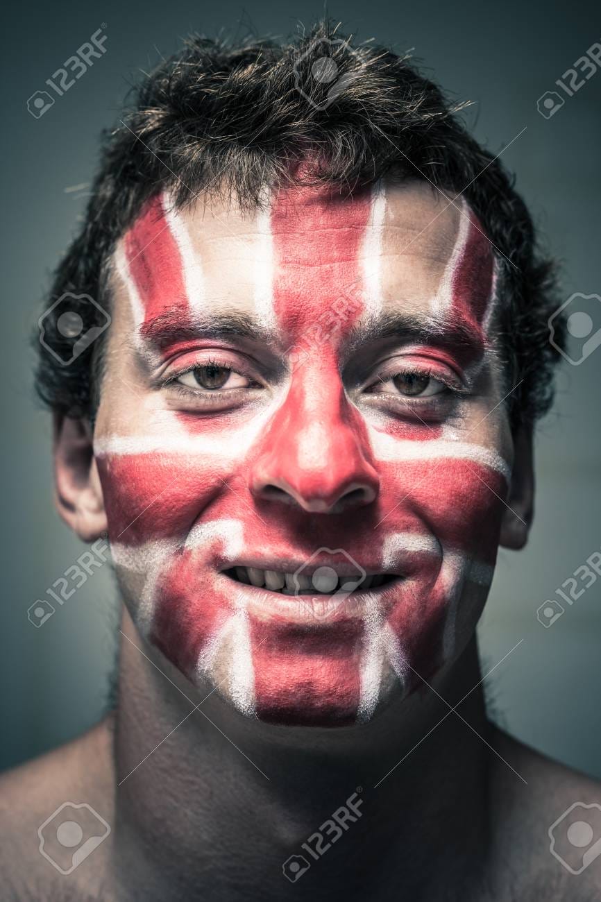 29780522 portrait of smiling man with british flag painted on his face