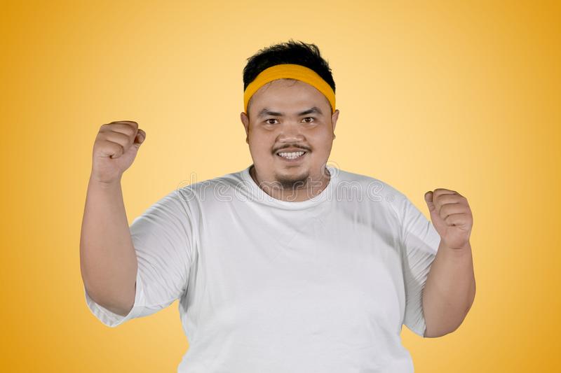 Fat man expressing his success to lose weight picture happy fat man expressing his success to 