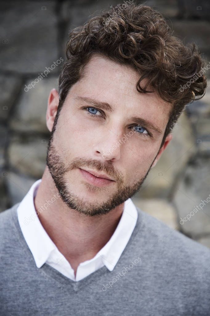 Depositphotos 222614188 stock photo good looking guy grey portrait