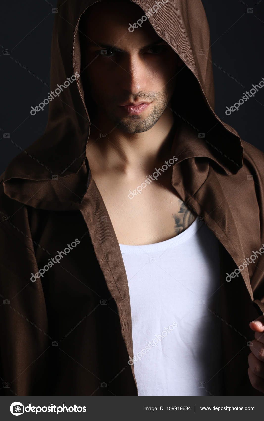 Depositphotos 159919684 stock photo handsome mysterious man wearing a